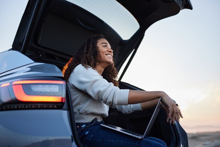 girl sit on a car