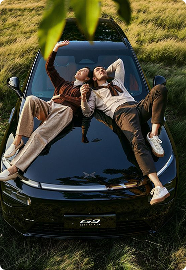 a couple on a car looking to the sky